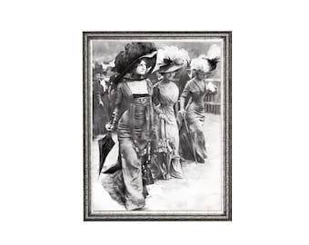 May include: A black and white framed print depicting three individuals walking outdoors, each wearing long dresses and large hats adorned with feathers. They carry parasols and are dressed in early twentieth-century attire with long sleeves.