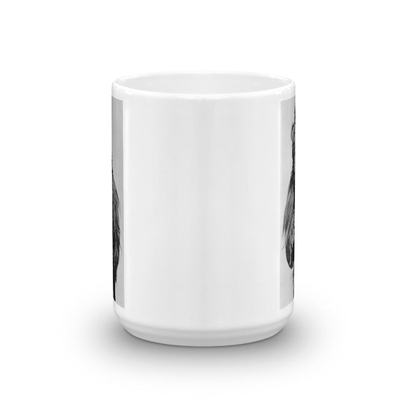 May include: White ceramic coffee mug with a black and white image of a rooster on one side.