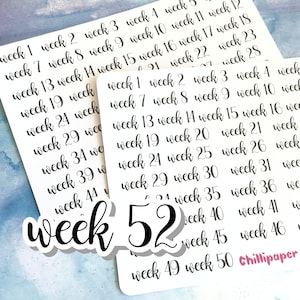 May include: A set of 52 black and white stickers with the word "week" and a number from 1 to 52. The stickers are on a white background.