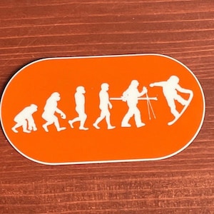 Pegatina evolution de snowboard en el parque