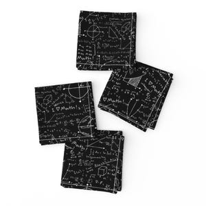 May include: Four black napkins with white mathematical equations, formulas, and symbols printed on them. The napkins feature the text "I ♡ Math!" and "calculus".