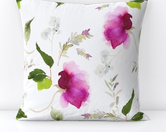 May include: White pillowcase with a watercolor floral pattern featuring pink flowers and green leaves.