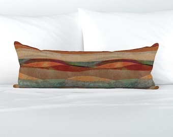 May include: A long rectangular throw pillow with a colorful abstract pattern. The pattern features wavy lines in shades of brown, orange, red, and green.