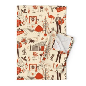 May include: Cream-colored fabric with a retro Christmas pattern. The design features Santa Claus, Christmas trees, flamingos, and mid-century modern homes. The words "Merry Christmas" are also visible.