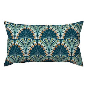 May include: Teal blue rectangular pillow with a repeating pattern of teal, white, and orange circles and arches.