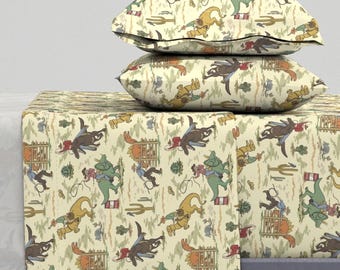 May include: A cream-colored bedding set with a repeating pattern of cowboys riding dinosaurs. The pattern includes cacti, barrels, and fences. The set includes a flat sheet, fitted sheet, and two pillowcases.