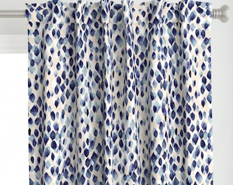 May include: Blue and white patterned curtain panels with a watercolor-like design. The pattern features a repeating motif of small, irregular shapes.