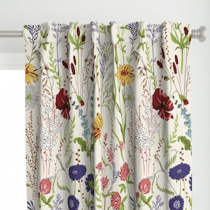 May include: A curtain panel featuring a cream-colored background with a repeating botanical print of wildflowers. The pattern includes yellow daisies, deep red poppies, purple cornflowers, pink clover, and various green grasses and stems.