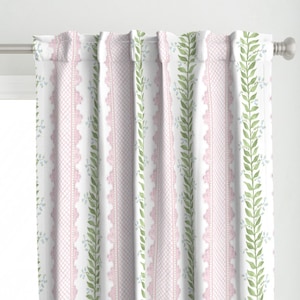 May include: White curtains with a pink and green floral pattern. The pattern features a repeating design of pink lattice, green vines, and small blue flowers.