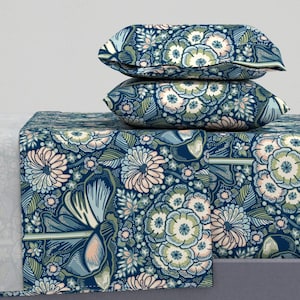 May include: A blue and green floral patterned bedding set with two matching pillowcases. The bedding features a variety of floral designs in shades of blue, green, and pink.