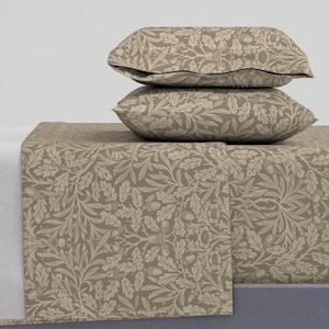 May include: A bedding set featuring a taupe and cream botanical pattern. The set includes a fitted sheet, a flat sheet, and two pillowcases. The design showcases a repeating pattern of leaves, acorns, and floral elements, creating a cohesive and nature-inspired aesthetic.