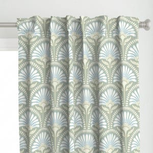 May include: Sage green curtain with a repeating floral pattern. The design features stylized white and light blue flowers arranged in a fan-like shape. The curtain is hanging on a silver rod.