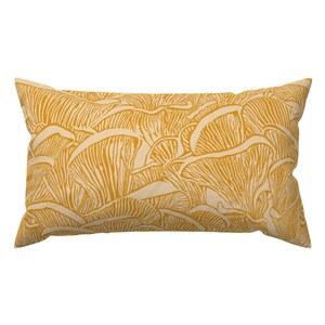 May include: A yellow throw pillow with a mushroom pattern. The pillow is made of a soft, comfortable fabric and is perfect for adding a touch of nature to your home decor.