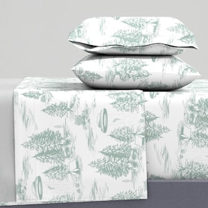 May include: White bedding set with a green and white pattern of trees and tents. The set includes a flat sheet, fitted sheet, and two pillowcases.