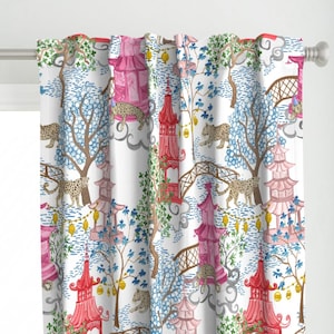 May include: A white curtain featuring a repeating pattern of pink and red pagodas, brown arched bridges, and spotted leopards. The design includes blue trees, green foliage, and yellow lanterns hanging between the structures on a white background.