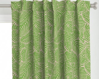 May include: Green and beige patterned curtains with a leaf design. The curtains are made of a soft, woven fabric and have a subtle sheen.