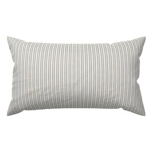May include: A white and blue striped throw pillow with a rectangular shape.