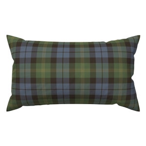 May include: A rectangular pillow with a green, blue, and brown plaid pattern.