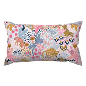 May include: A white pillow with a colorful pattern of tigers, flowers, and geometric shapes. The pattern is in shades of pink, blue, yellow, and orange.