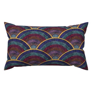 May include: A rectangular pillow with a geometric pattern of overlapping, colorful, semi-circular shapes. The pattern is reminiscent of a mosaic or tile design. The background color is a deep blue, and the shapes are in shades of red, purple, and green. The edges of the shapes are outlined in gold.
