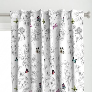 May include: White curtain with a floral and butterfly design. The curtain features a black and white floral pattern with colorful butterflies in shades of red, blue, green, and pink. The curtain is hanging on a white rod.