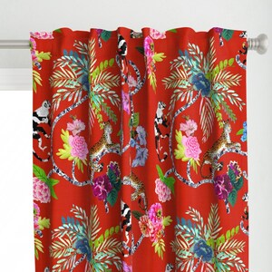 May include: Red fabric curtain with a tropical print featuring monkeys, leopards, and flowers. The print is in shades of green, pink, and white.