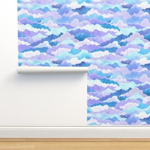 May include: A seamless pattern wallpaper featuring a repeating design of blue, purple, and white clouds. The clouds are layered and overlapping, creating a sense of depth and dimension.
