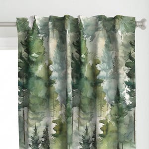 May include: Watercolor-style curtain panel featuring a forest scene. The design showcases tall evergreen trees in shades of green and gray, creating a serene, natural aesthetic. The curtain is mounted on a silver rod with white finials, adding a touch of elegance.