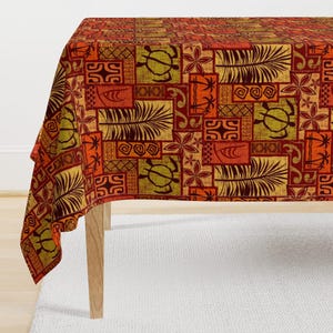 May include: A red, orange, and yellow tablecloth with a geometric pattern of palm trees, turtles, and waves. The pattern is reminiscent of traditional Polynesian designs.