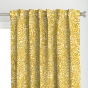 May include: Yellow curtains with a white abstract pattern. The pattern is made up of small, white lines that create a swirling effect.