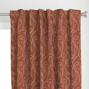 May include: A rust-colored curtain with a white line drawing pattern of abstract figures. The figures are repeated throughout the fabric.
