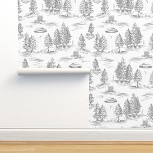 May include: A white background with a repeating pattern of gray trees, tents, and flying saucers. The pattern is reminiscent of a vintage illustration.