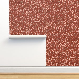 May include: Red wallpaper with a white floral pattern. The pattern features small white flowers and leaves on a solid red background.
