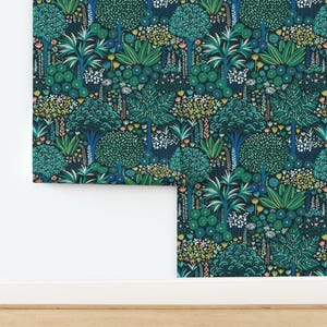 May include: A repeating pattern wallpaper featuring a dark blue background with a variety of green, blue, and yellow foliage and flowers.