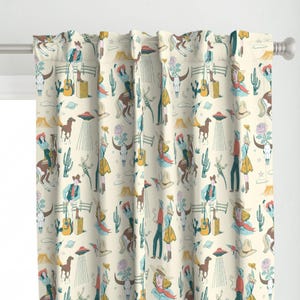 May include: A cream-colored curtain fabric with a repeating pattern of cowboys and cowgirls riding horses, cacti, and UFOs. The pattern is in shades of blue, green, yellow, and pink.