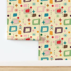 May include: Wallpaper featuring a repeating pattern of rounded squares, starbursts, circles, and triangles in teal, red, pink, orange, and dark brown on a light beige textured background. The design includes various geometric shapes and lines.