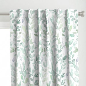 May include: White curtains with a watercolour pattern of green leaves and branches.