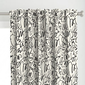 May include: White curtains with a black and white abstract pattern of scribbles and swirls.