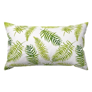 May include: A white rectangular cushion with a green fern leaf pattern.