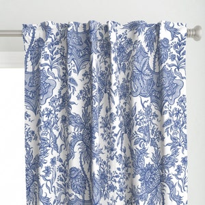 May include: Blue and white patterned curtain panels with a floral design. The pattern features intricate details and a repeating motif.