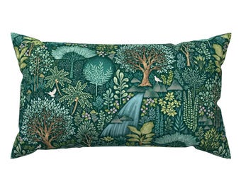 May include: A green rectangular pillow with a patterned design of a forest scene with trees, flowers, and a waterfall.