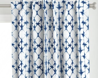 May include: White curtains with a blue geometric pattern. The pattern is a repeating design of stars and diamonds.