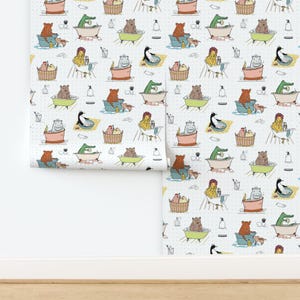May include: Wallpaper featuring a repeating pattern of various animals, including bears, alligators, and hippos, relaxing in bathtubs. The design includes a light blue background with small white dots and colorful illustrations.