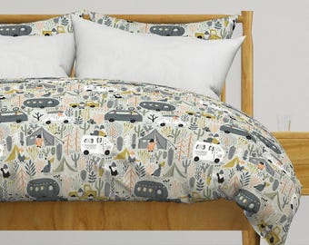 May include: A light gray and white duvet cover with a repeating pattern of campers, trees, and cacti. The pattern is in shades of gray, white, yellow, orange, and green.