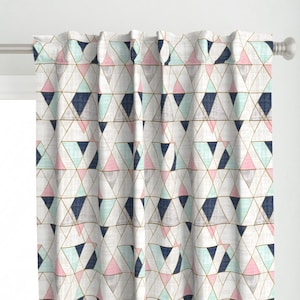 May include: A white curtain with a geometric pattern of pink, blue, and green triangles. The triangles are outlined in gold.