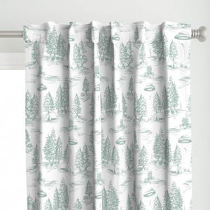 May include: White curtains with a repeating pattern of green trees, tents, and flying saucers. The pattern is a stylized drawing.