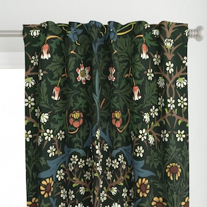 May include: A pair of dark green curtains with a floral pattern featuring white, yellow, orange, and blue flowers. The pattern is a repeating design of stylized flowers and leaves.