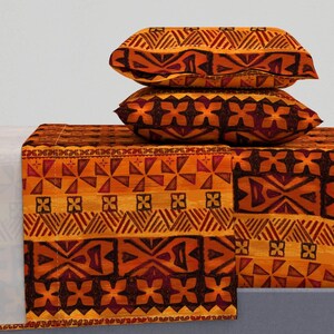 May include: A set of orange and brown patterned bedding with geometric designs. The set includes a flat sheet, fitted sheet, and two pillowcases.
