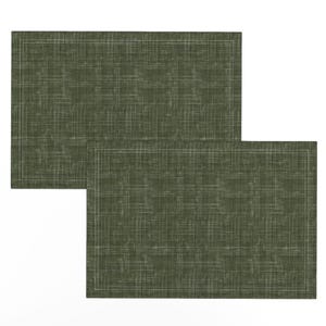May include: Two green placemats with a subtle woven texture and a white border.