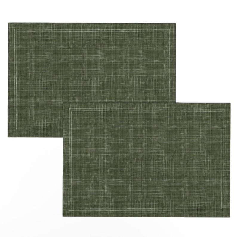 May include: Two green placemats with a subtle woven texture and a white border.
